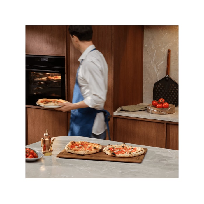 Person with the pizza expert oven and Neapolitan pizzas 