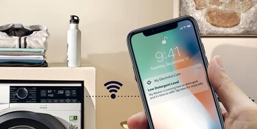 woman looking at My Electrolux App in mobile