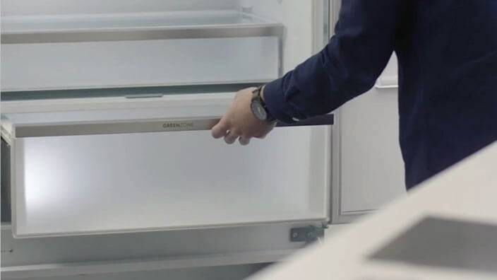 Opens fridge drawer