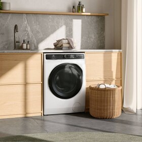 Washing machine placed in a laundry room.
