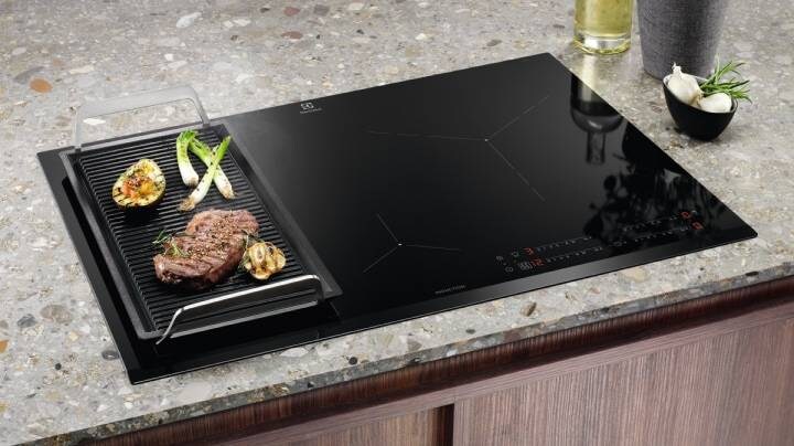 Food cooking on kitchen hob